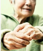 An older woman holding out her hands