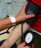 Checking blood pressure using a sphygmomanometer