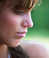 A young woman looking sad