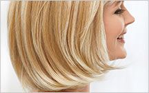 smiling woman with blonde wig